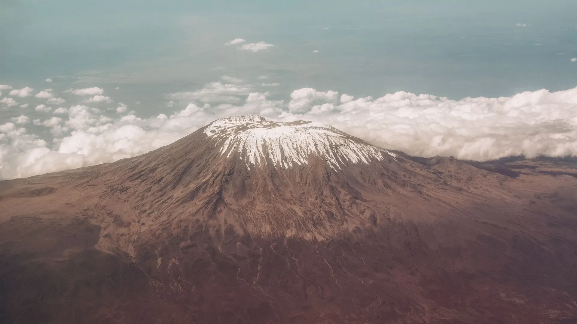 Mount Kilimanjaro snow-capped peak above the clouds