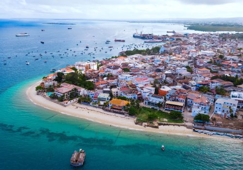 View of the tropical island of Zanzibar, featuring a serene bay View of the tropical island of Zanzibar, featuring a serene bay